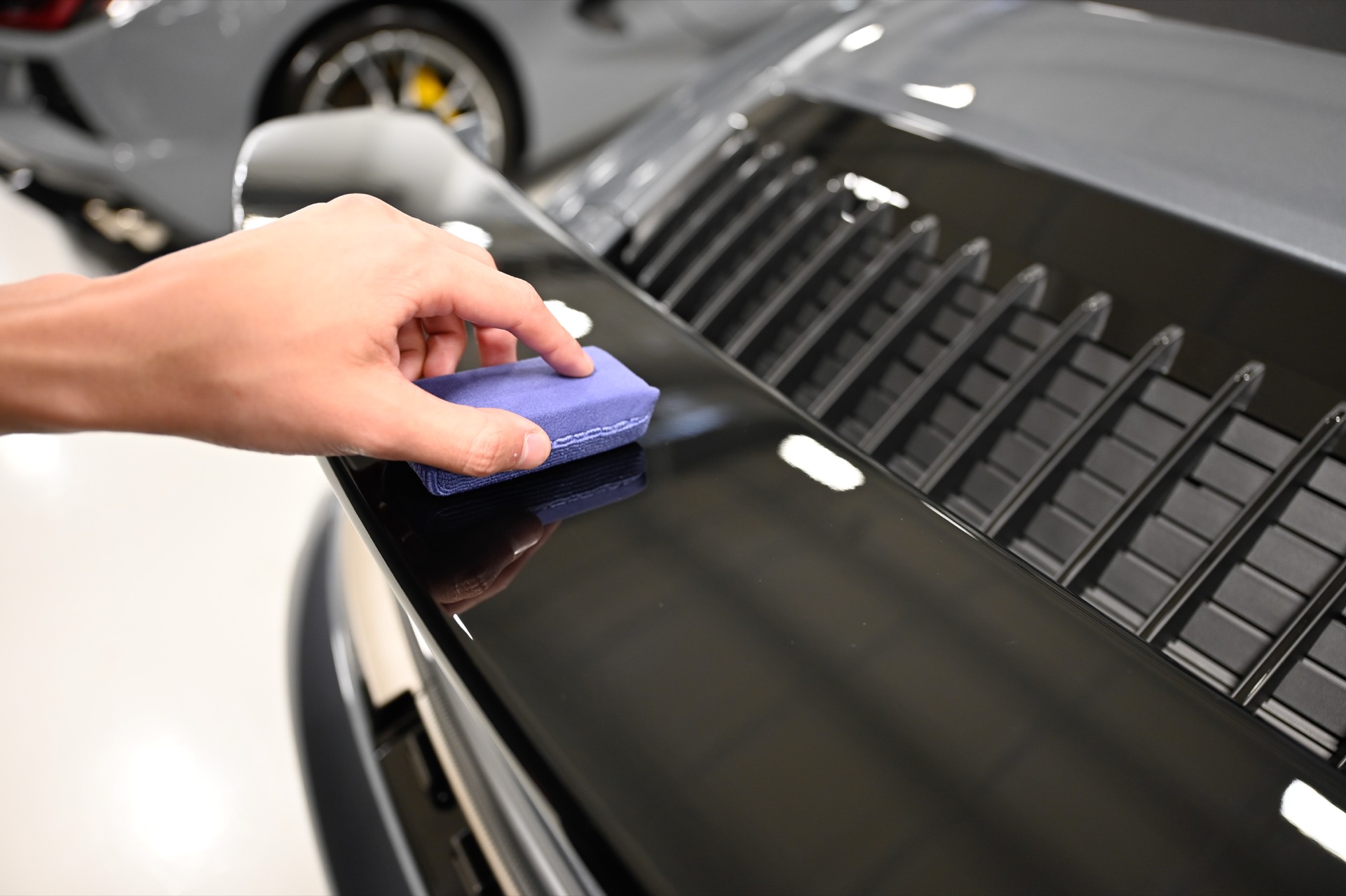 Gyeon ceramic coating being applied by hand at A Buff & Beyond