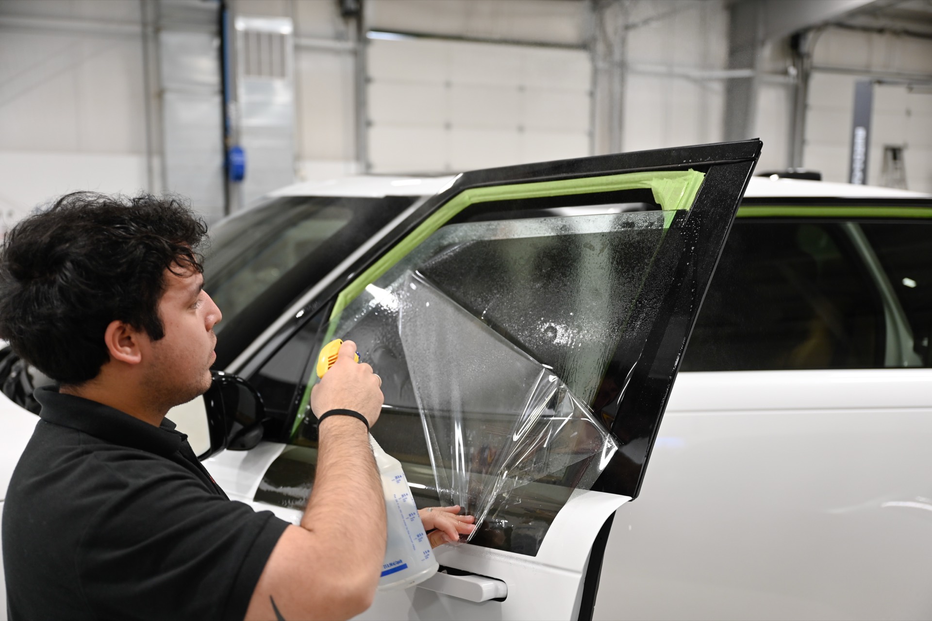 LLumar ceramic window tint being applied at A Buff & Beyond